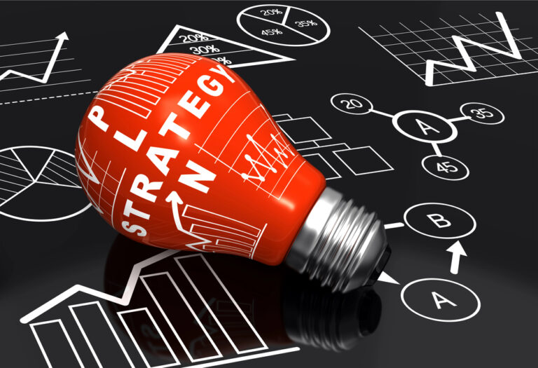 Red light bulb with the words "Plan" and "Strategy" surrounded by charts, graphs, and flow diagrams representing planning and strategic thinking.